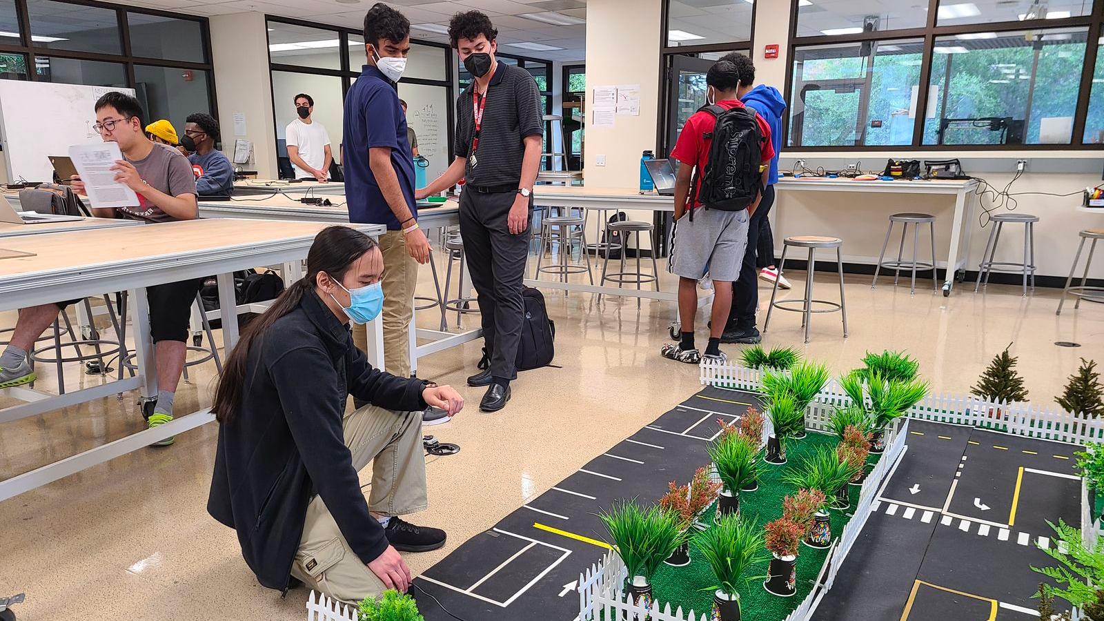 photo: students working a laboratory.